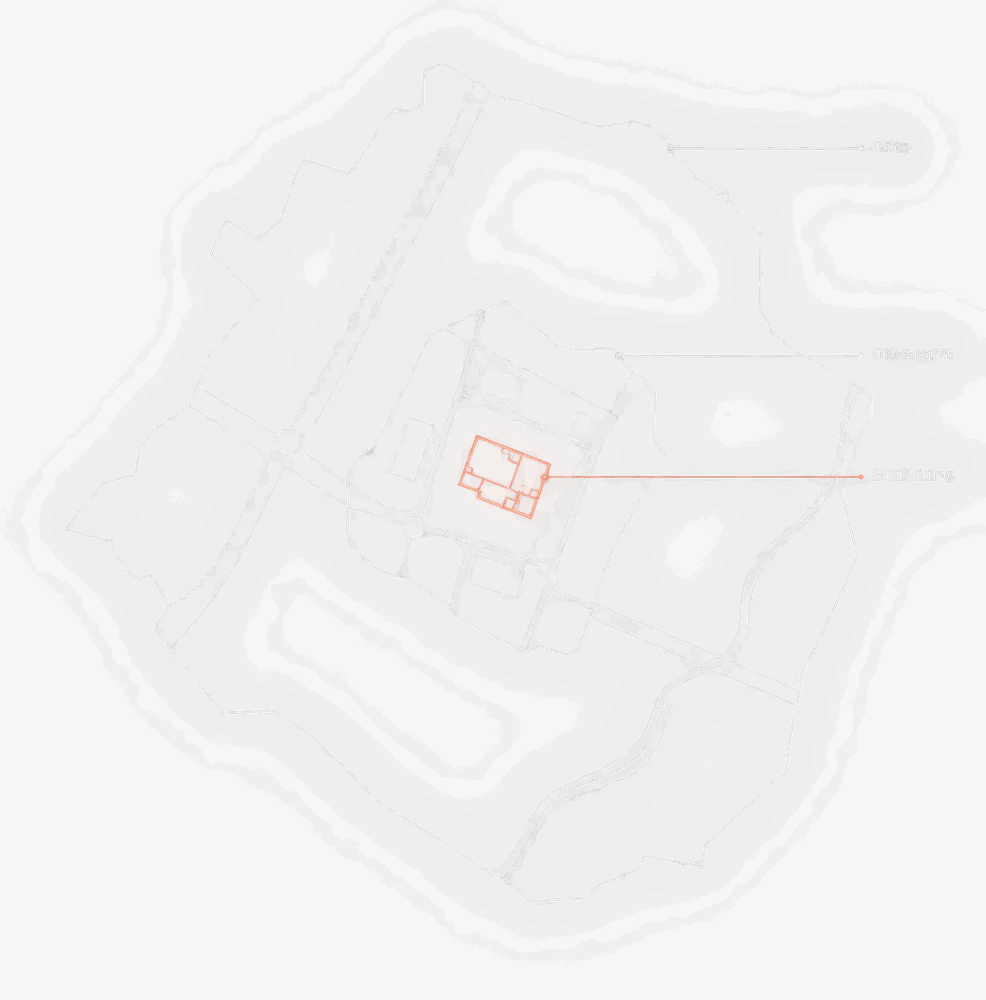 Nested plan view: a single building outlined in salmon, sitting inside a district parcel, sitting inside a wider city boundary.
